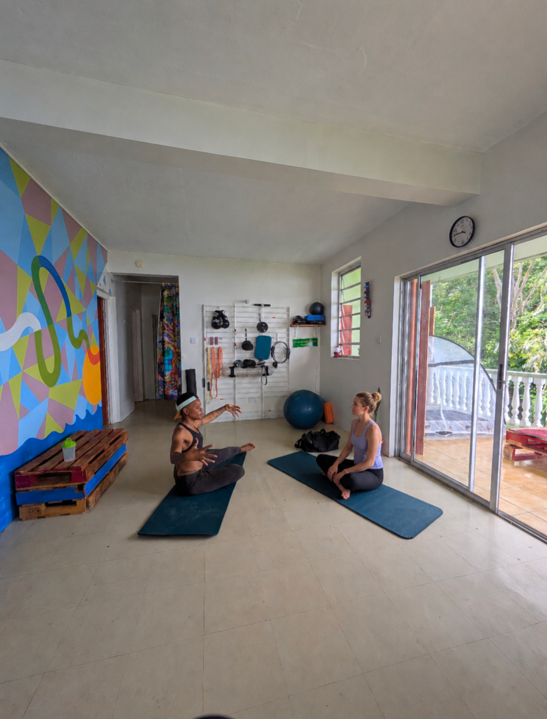 Ketty guiding a Pilates student in the Fortune studio